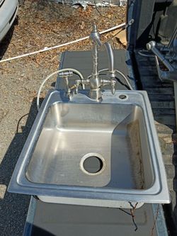 Single sink with frank faucet