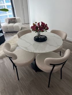 Dining table marble like top set with cloud boucle chairs