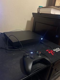 Xbox one X, chargeable battery four games and all cables