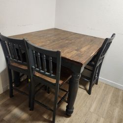 Large wooden table with 6 chairs