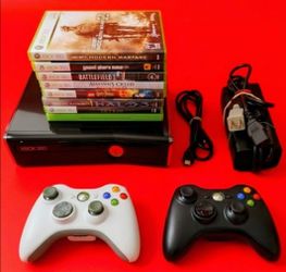 Microsoft Xbox 360 slim with 2 controllers 8 games HDMI cord power supply