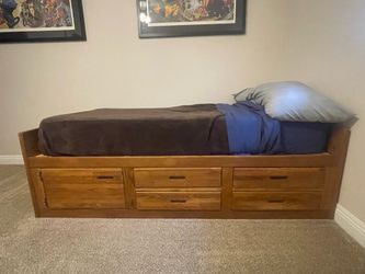 Oak twin bed complete with mattress