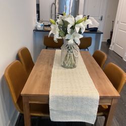 Dining table purchased from IKEA with stylish brown leather chairs!