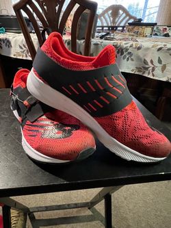 New Balance FuelCore Reveal Boa for adults, size 7, in red and black.