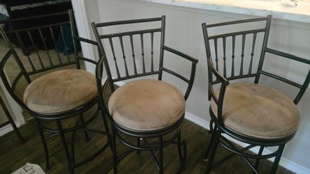 Three high quality swivel barstools