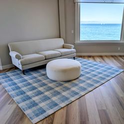 Couch, ottoman and rug