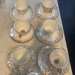 White and gold tea cups and plates