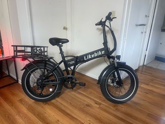 City Fun Fat Tire Mountain E-bike  with strong  heavy duty basket.  It come with charger.