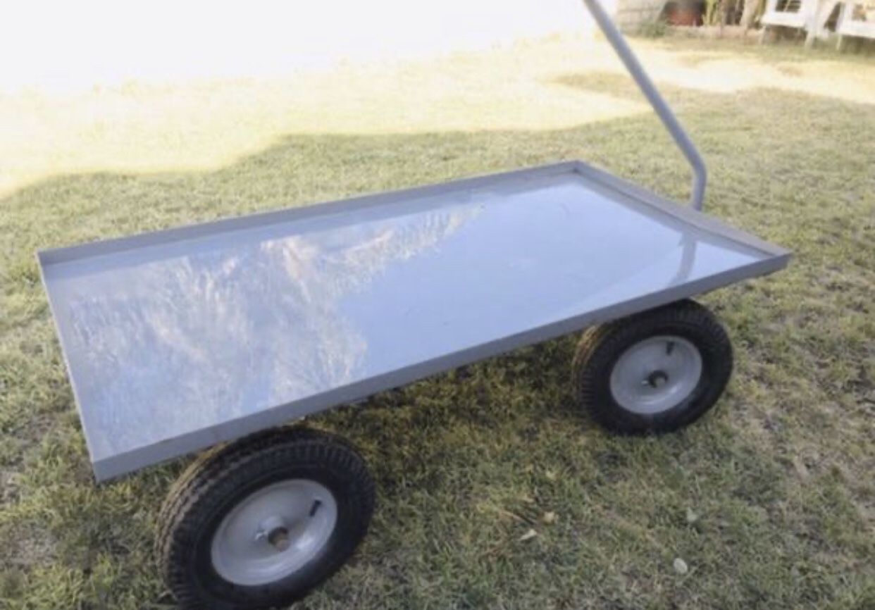 Metal wagon cart - heavy duty Used all wheels get stuck needs some repair on that ... Like new never used -FROM ULINE METAL BIG WAGON CART