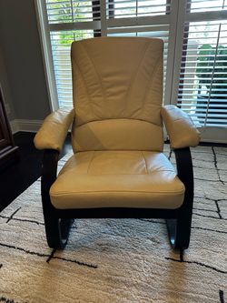 Cream leather flexible armchair in dark wood finish frame