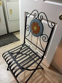 Two foldable metal chairs