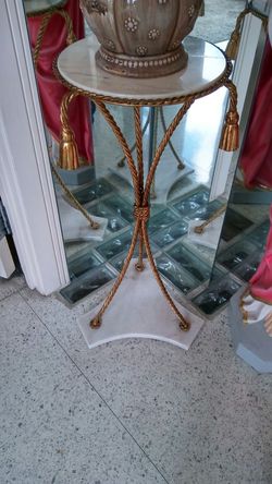Brass.tassel end table..
