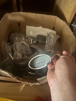 Box full of Golf club heads.