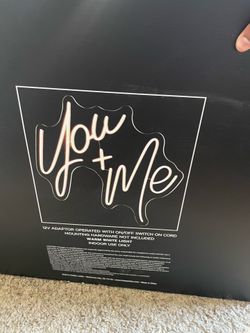 Two “YOU + ME” led sign