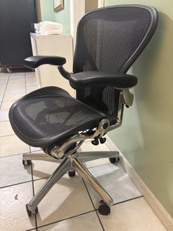 Unique chrome and black earon herman miler chair