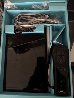 Wii console in box with Wii sports resort