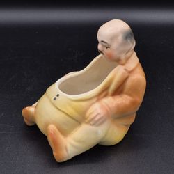 Vintage Porcelain Fat Man Sitting Pipe Holder