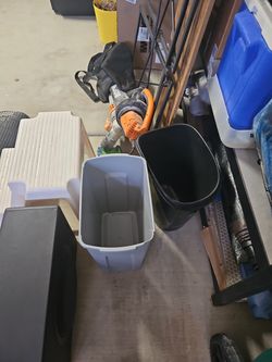 Two waste baskets one super narrow