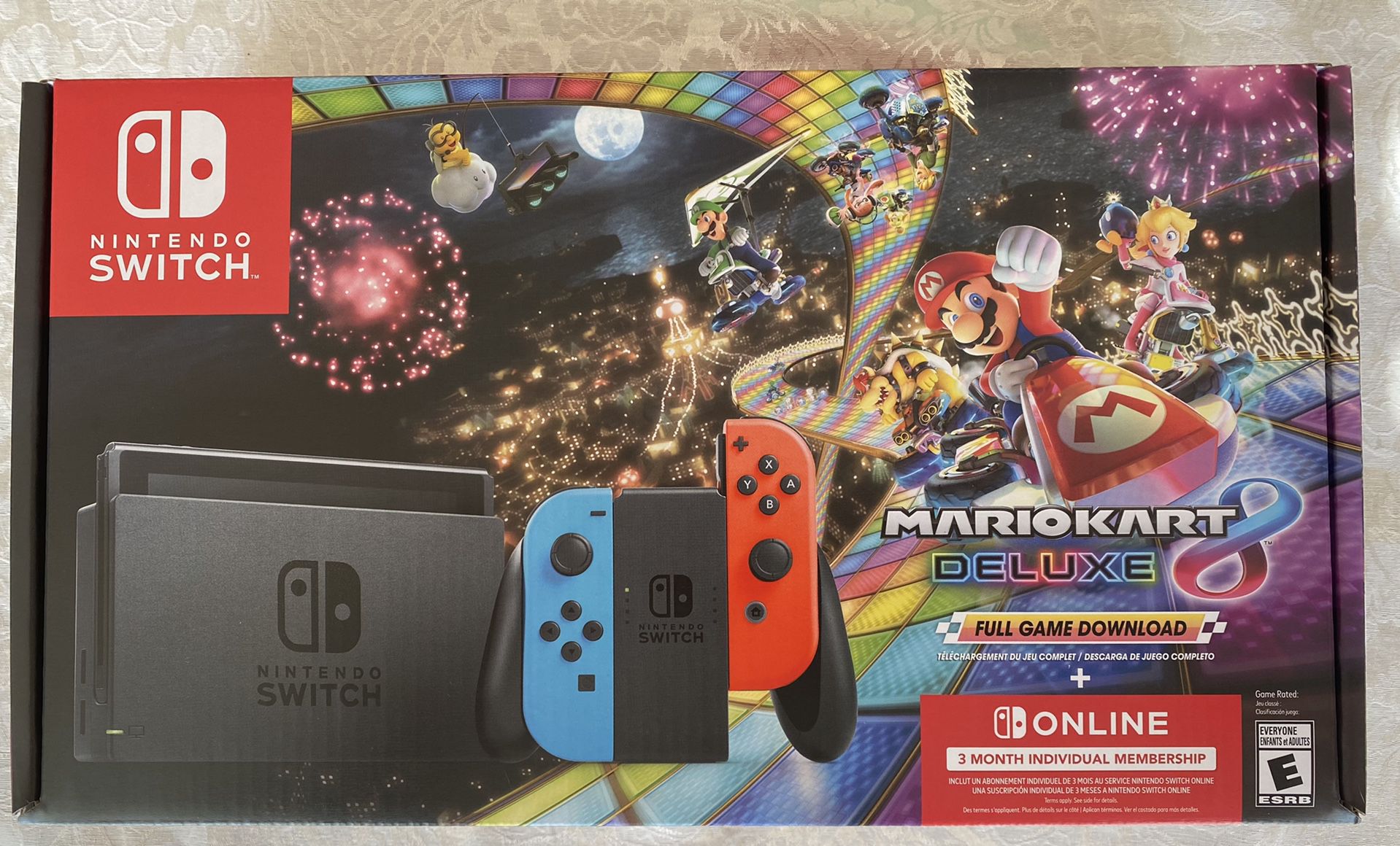 New Nintendo Switch with Neon Joy-Con, Mario Kart 8 Deluxe, and Nintendo Online 3 Month System Bundle. .