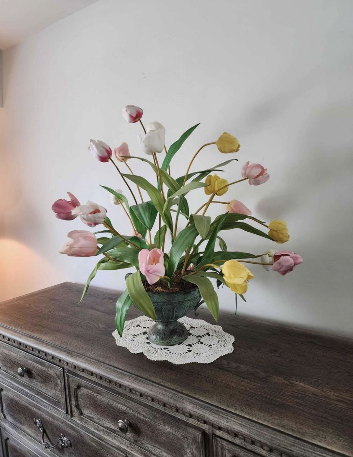 Beautiful imitation flowers with imitation brass vase/pot. Pretty lightweight.