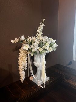 Roman vase with white flowers