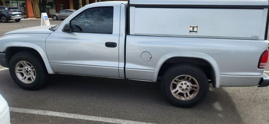 2003 Grey dodge dakota truck with metal camper