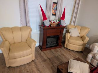 Scalloped Arm Chairs That Swivel