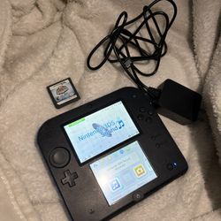 Nintendo 2ds with charger and a game 