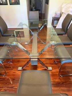 Glass table with 8 chairs