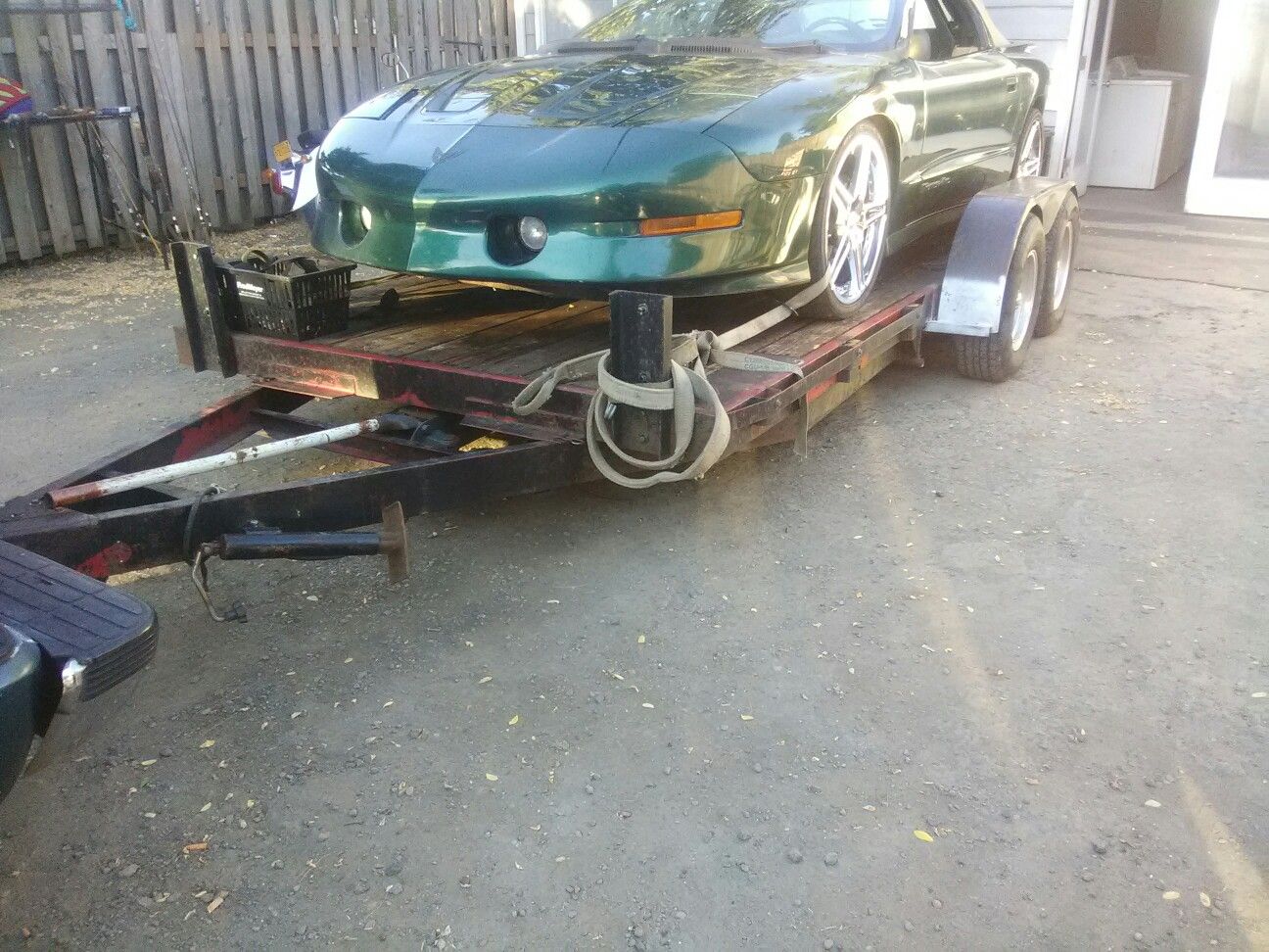 Tandem axle flatbed car trailer mushrooms and tires