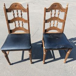 A pair of vintage traditional ladderback chairs