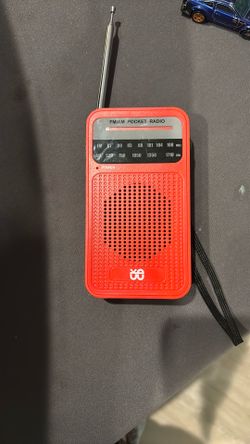 red AM/FM pocket radio