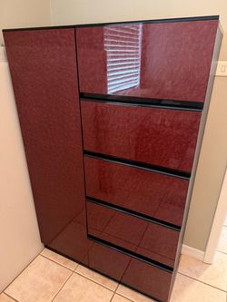 Upright cabinet with drawers and shelves.
