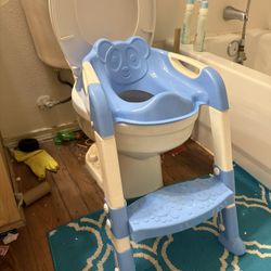 Selling a toddler potty training seat with built-in ladder and step. Fits standard toilets. Very stable, comfortable, and easy for kids to climb on th