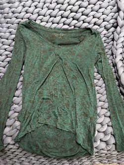Lightweight long-sleeve top with an all-over subtle damask pattern.