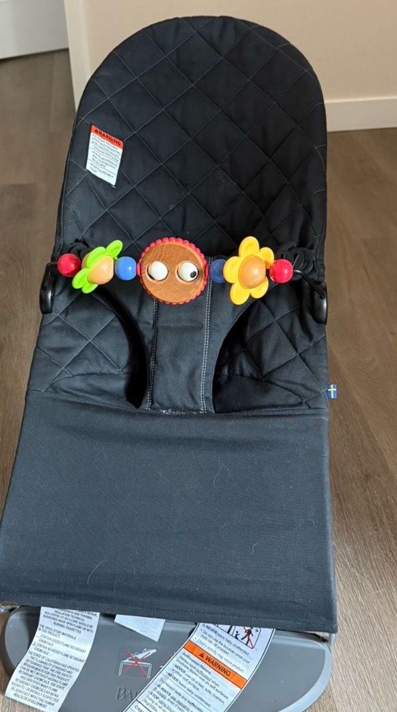 Black Baby Bjorn Bouncer with Toy Bar
