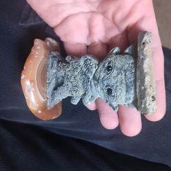 Stone carved statue on agate base