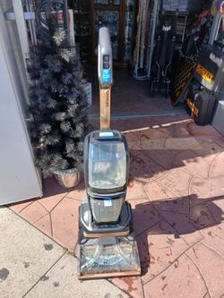 a Bissell Revolution HydroSteam Carpet Cleaner
