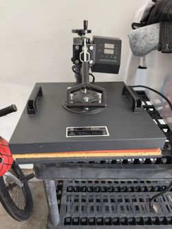 Heat press for shirts, cups, and hats fairly new.