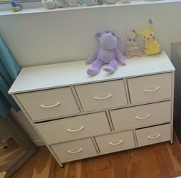 White dresser, tall dark brown dressers and two light brown matching chest of drawers
