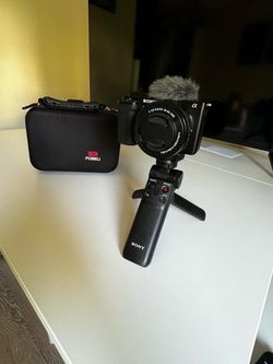 Sony ZV-E10 with Sony E PZ 16-50mm f/3.5-5.6 OSS Lens, Sony Sony SF-E64A E Series UHS-II SDXC Memory Card, Carrying Case, Tripod, and Charging Cable