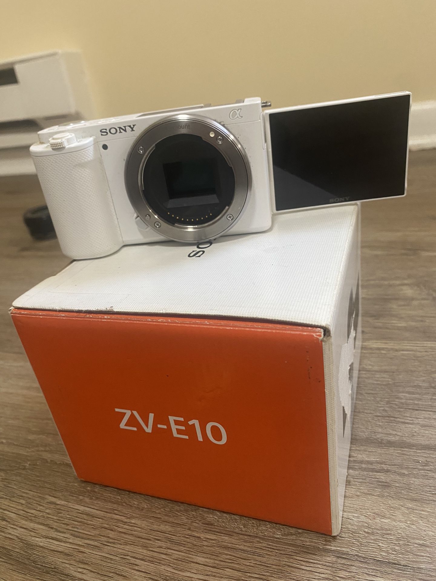 ZV-E10 Vlogging Camera With Charger And Neck Strap To Support Camera While Shooting