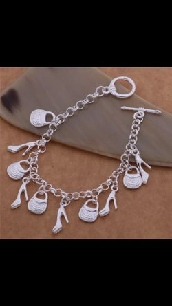 Purse and shoe sterling silver bracelet! Brand new! Really cute gift! Stamped 925