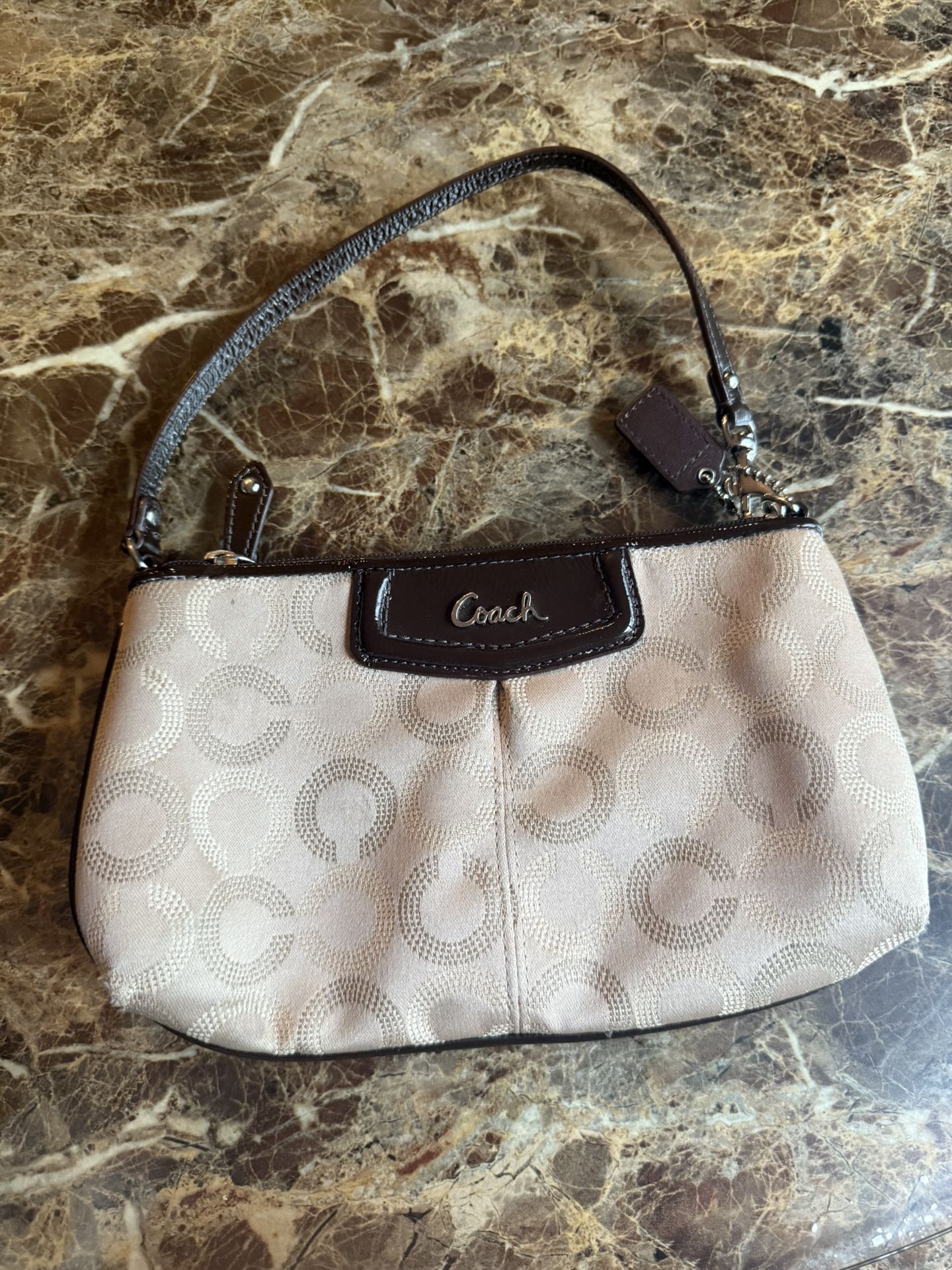 Coach Dotted C Logo Wristlet in cream