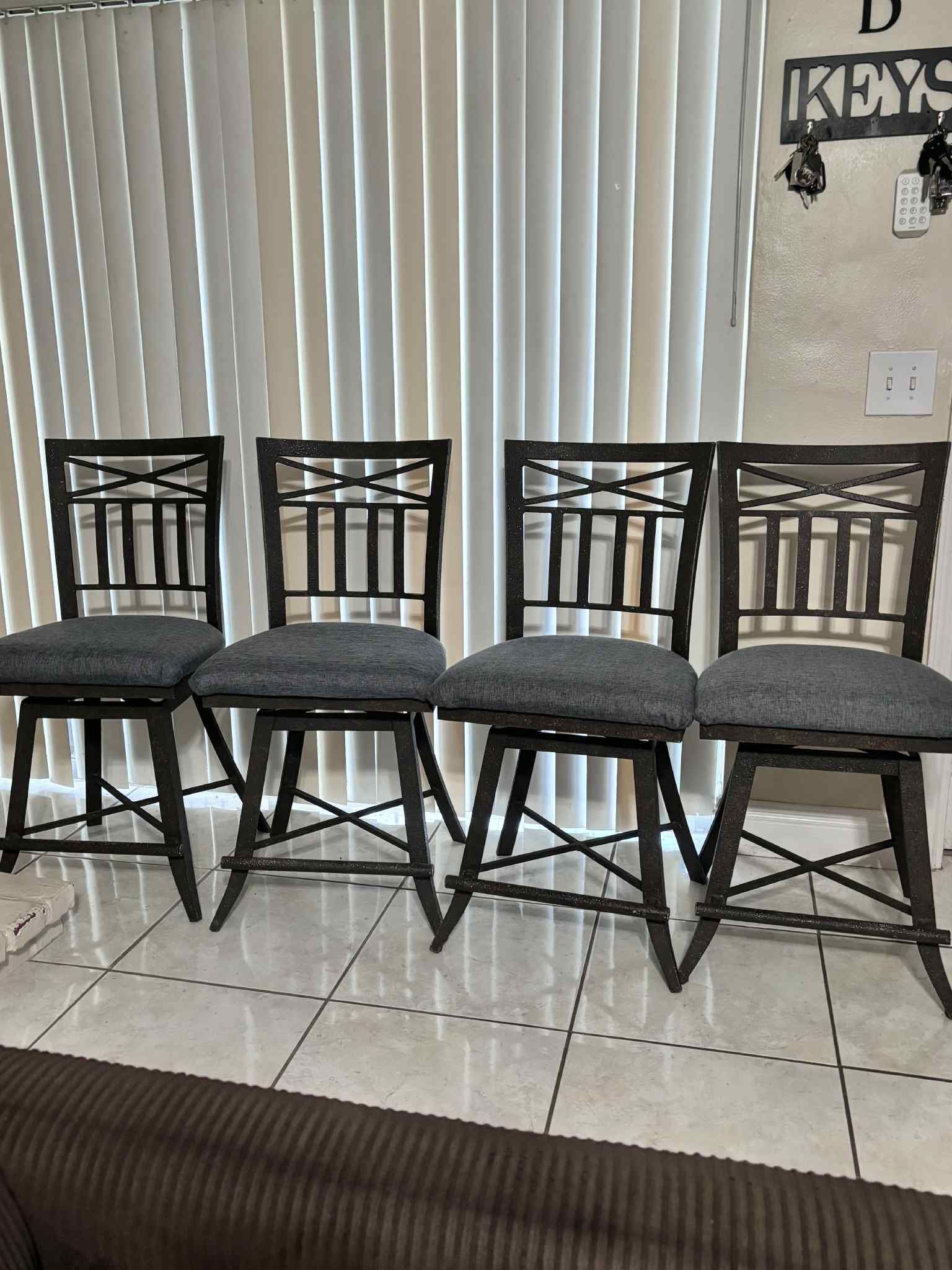 4 Wrought-Iron Swivel Bar Stools