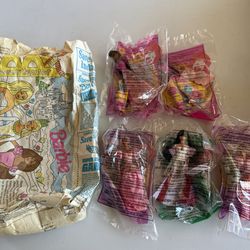McDonald's Happy Meal Barbie toys and a matching paper bag from the late 1990s.
