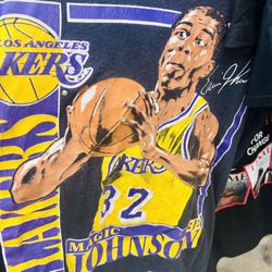 Vintage vintage Magic Johnson t-shirt 1990s era, officially licensed Nutmeg Mills product, which are popular among collectors. 