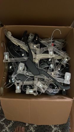 A box of assorted plastic hangers