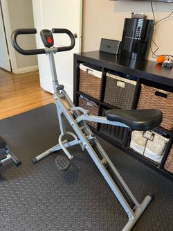 Squat assistant rower