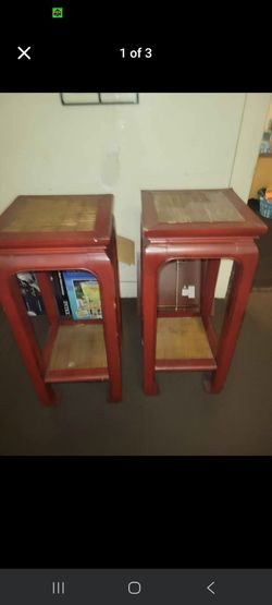 Pair of Chinese Style Red Lacquer Plant StandsRed lacquer wood plant stands with a square top and lower shelf. These stands have a traditional Ming-st